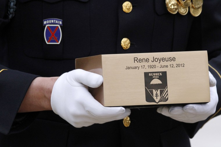 The remains of Dr. Rene Joyeuse, of Saranac Lake, New York, a decorated Swiss-born WWII spy, during burial services at Arlington National Cemetery in Arlington, Va., March 29.