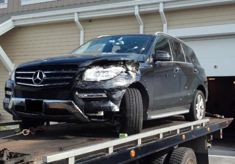 In this photo obtained by NBC News, a tow truck delivers a
bullet-riddled black Mercedes SUV to police headquarters in Watertown,
MA, on Friday aftern...