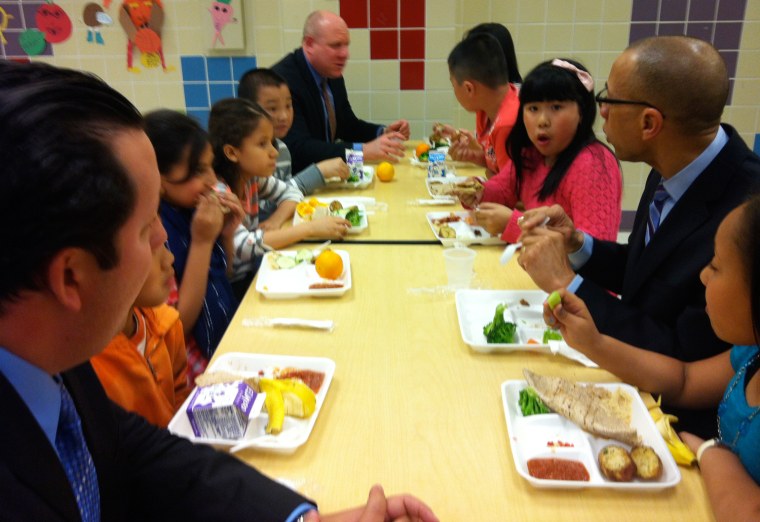 Elementary schoolchildren at P.S. 244 in Flushing, Queens, enjoy a vegetarian lunch on Tuesday during a visit by New York Schools Chancellor Dennis M. Walcott.