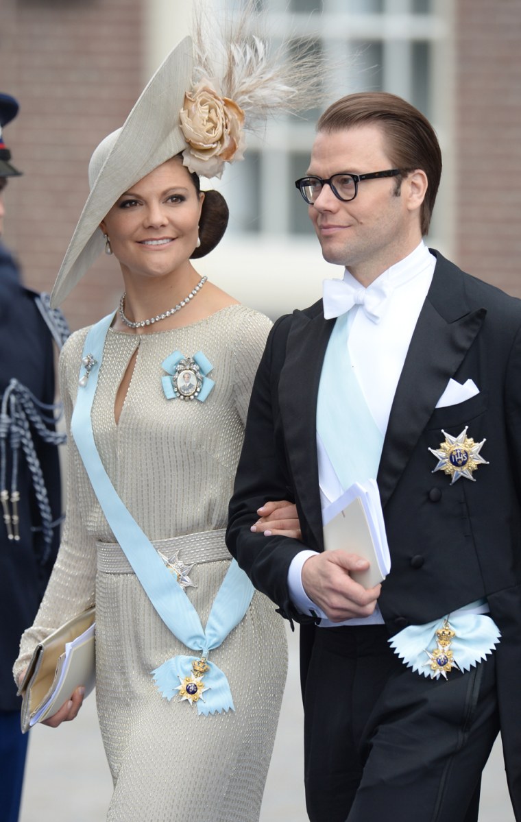 Sweden's Crown Princess Victoria and Prince Daniel leave the Nieuwe Kerk (New Church) in Amsterdam on April 30, 2013 after attending the investiture o...