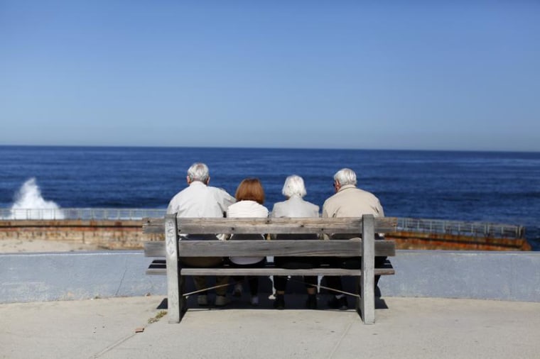 A pair of elderly couples view the ocean and waves along the beach in La Jolla, California March 8, 2012. REUTERS/Mike Blake