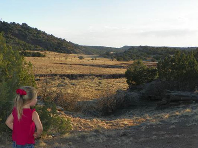 Image: One of the Wieland girls looks off in the distance in the mountains near Santa Fe, N.M.