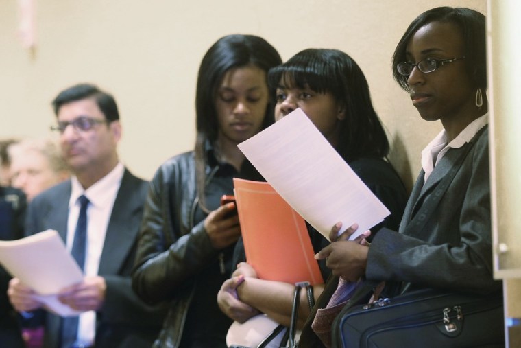 People wait on line to attend a Long Island job fair on May 2, 2013 in Uniondale, New York.
