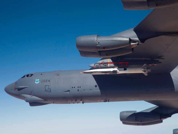 The U.S. Air Force's sleek, light-colored X-51A Waverider hypersonic vehicle can be seen tucked under the wing of a B-52H Stratofortress for this week's test launch.