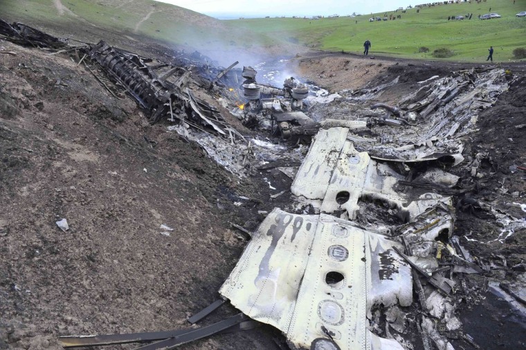 Wrecked refueling plane debris scattered across hillside in Kyrgyzstan