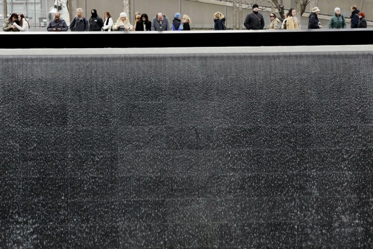 Visitors look over the waterfalls at the National September 11 Memorial and Museum on Feb. 25 in New York.