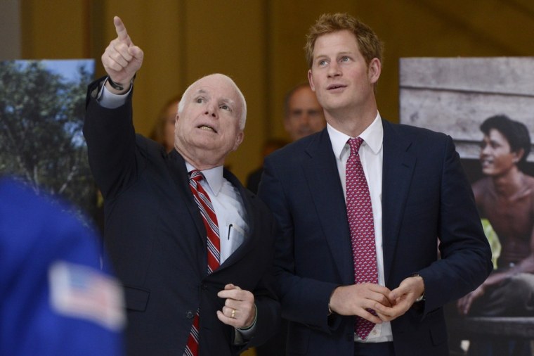 WASHINGTON, DC - MAY 09:  Prince Harry (R) of Wales tours a HALO Trust photo exhibit on landmines and unexploded ordinances, with Republican Senator f...