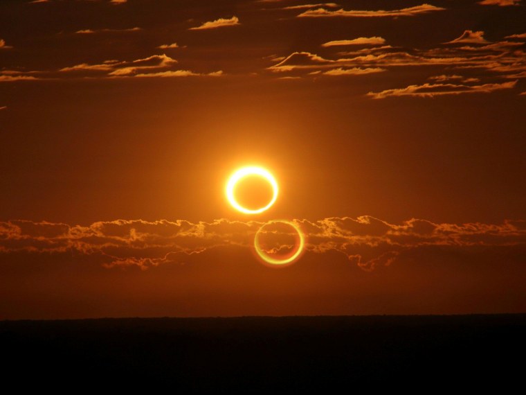 Friday's annular solar eclipse blazes like a ring of fire after sunrise, 45 miles (70 kilometers) south of Newman, Australia. Click on the picture for details from SpaceWeather.com.