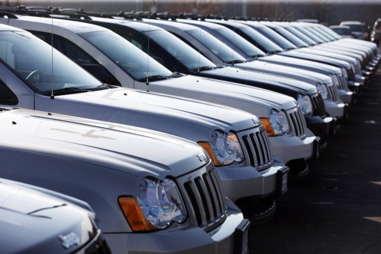 In this March 7, 2010 photo, 2010 Jeep Grand Cherokees sit at a Chrysler Jeep dealership in Centennial, Colo. Chrysler Group LLC reported Monday May 3...
