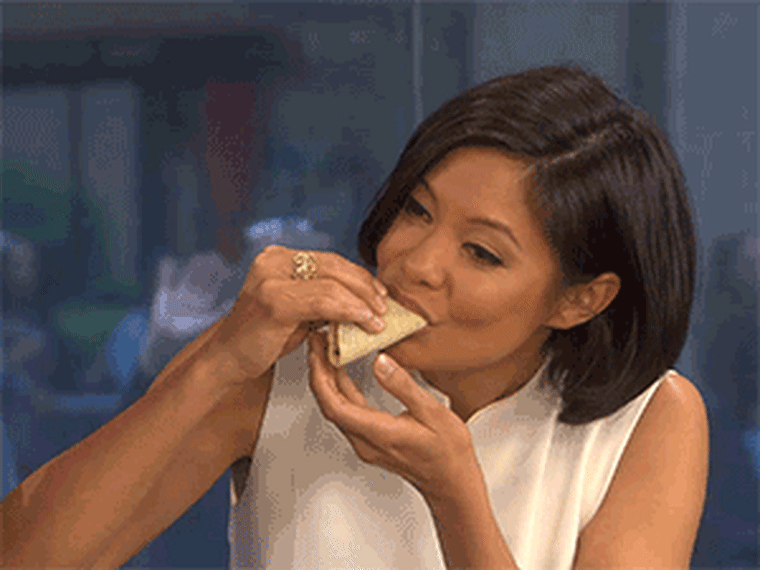 MSNBC's Alex Wagner takes a hearty bite of her grasshopper taco, savoring the insect goodness.