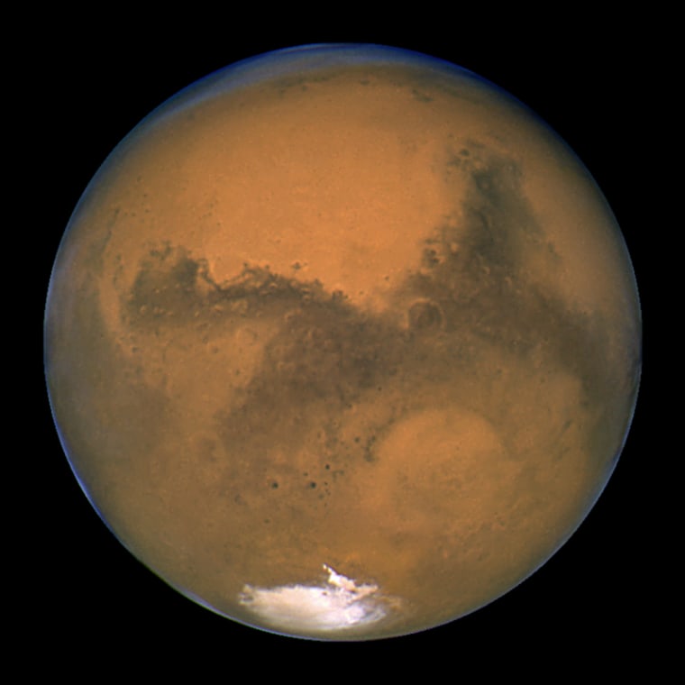 Mars looms large in a Hubble Space Telescope photo - and in the imaginations of those who have signed up for a one-way trip to the Red Planet.