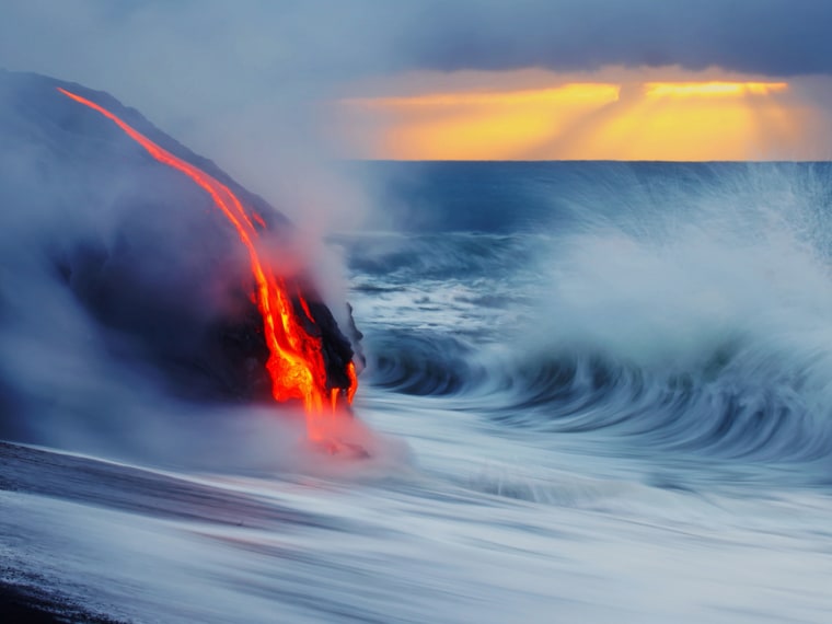 Photographers Nick Selway and C.J. Kale jumped into near-boiling water in swim trunks and fins to capture stunning images of lava colliding into a breaking wave at a volcano site on the island of Hawaii.