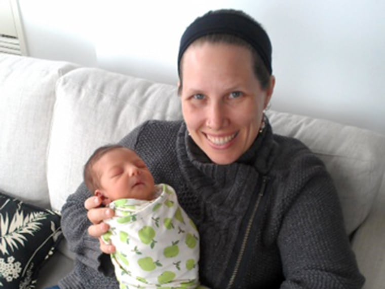 Doula Megan Davidson with one of the babies she helped deliver.