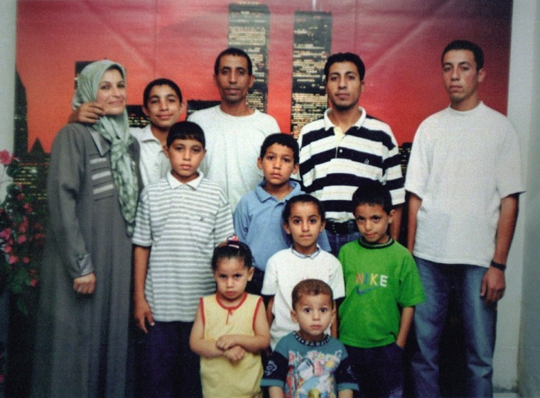 The family of 12 year-old Palestinian boy Mohammed al-Dura, center, in blue shirt, poses in an undated family photo at their home in the Gaza Strip. Mohammed's apparent death captured the world's attention.