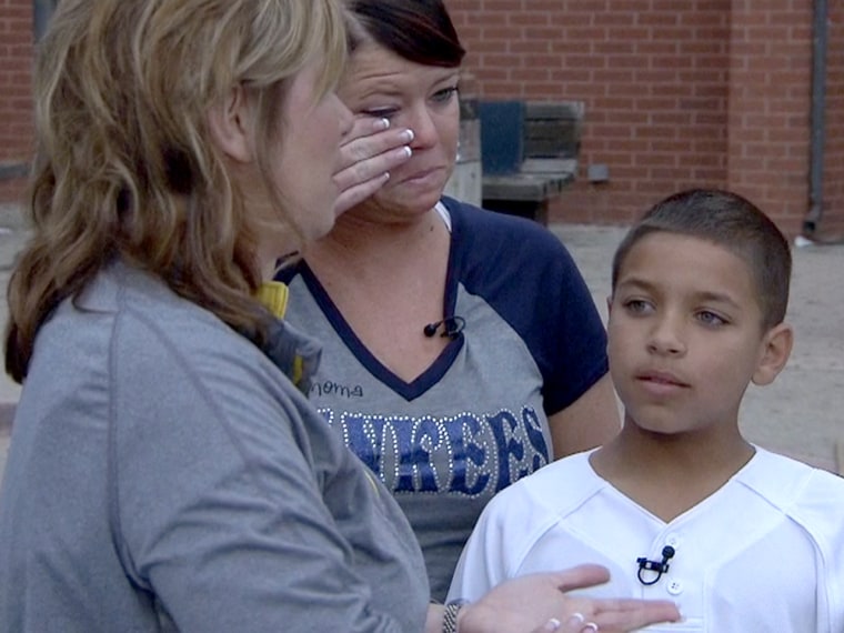 'I told you you were going to be OK,' teacher Rhonda Crosswhite told Damian Britton as she reunited with him.