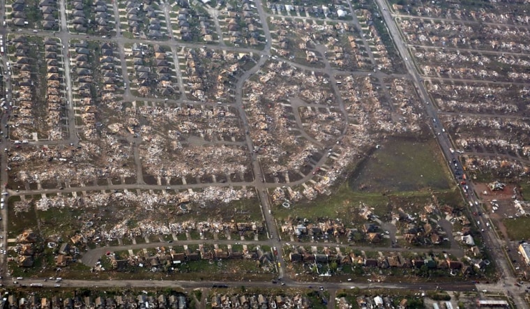 The remains of homes hit by a massive tornado are seen in Moore, Okla., Monday, May 20.