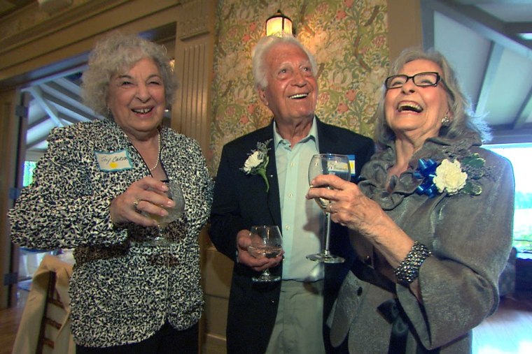 Honey Pegnataro, right, shares a toast with some of her classmates at the Hillhouse High School class of 1943 reunion and prom.