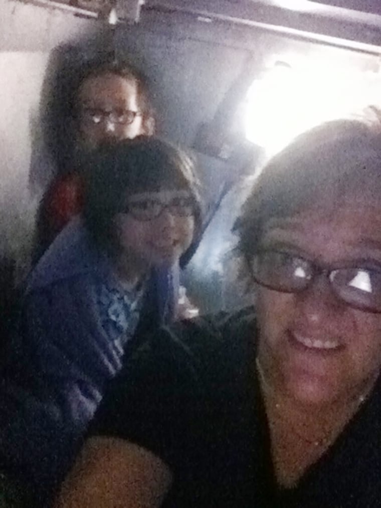 Mari Farthing with kids Spencer, 11, and Lauren, 8, in their Oklahoma City storm shelter Monday night.