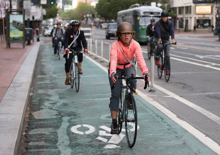 SAN FRANCISCO, CA - MAY 09: Bicyclists ride along Market Street on May 9, 2013 in San Francisco, California. The San Francisco Municipal Transportati...
