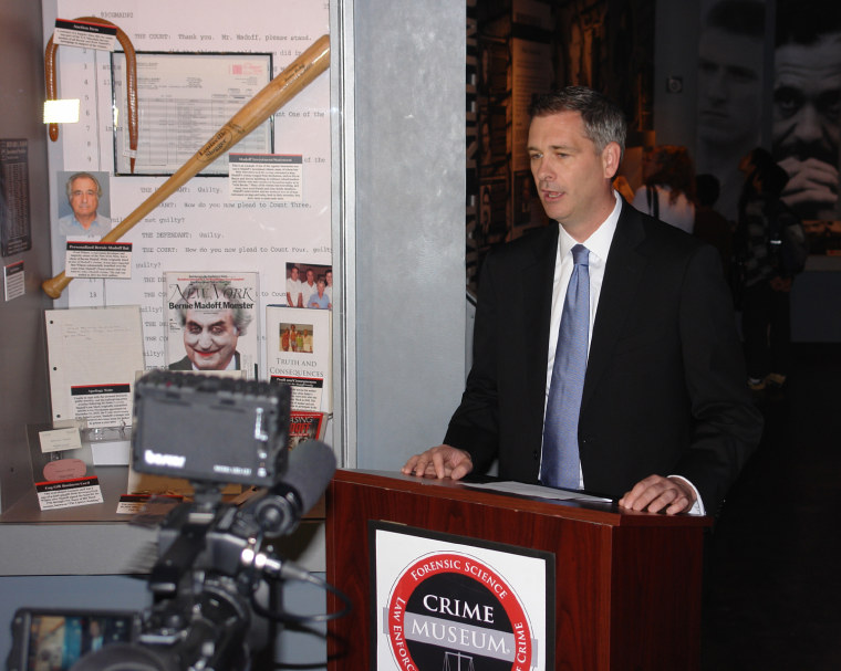image: FBI agent James Barnacle speaks at the Crime Museum.