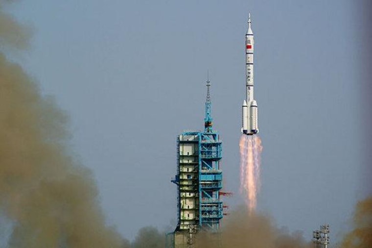 A Chinese Long March 2F rocket launches on the Shenzhou 9 mission, China's first manned space docking flight and first flight of a female astronaut, on June 16, 2012 from the Jiuquan Satellite Launch Center.