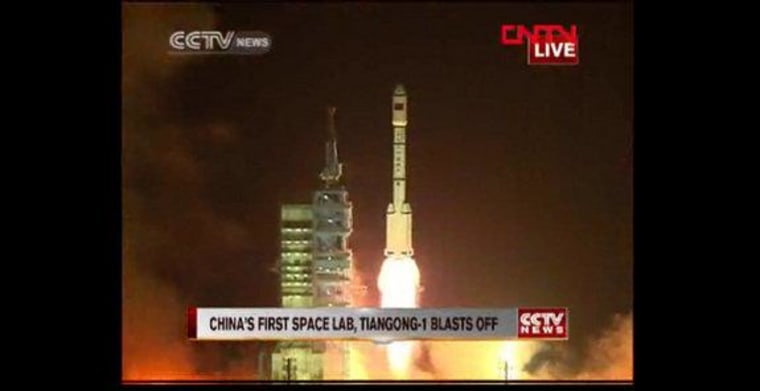 China launches the Tiangong-1 space lab module Sept. 29, 2011 atop a Chinese Long March 2F rocket from the Gobi desert.