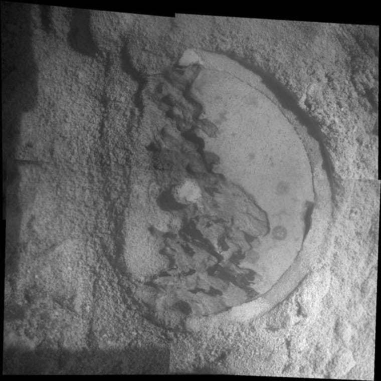 This mosaic of four frames shot by the microscopic imager on the robotic arm of NASA's Mars Exploration Rover Opportunity shows a rock target called