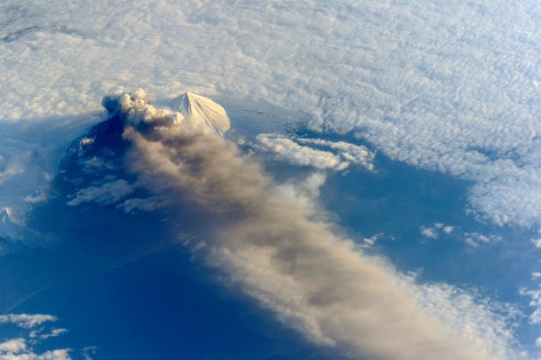 Astronauts aboard the International Space Station (ISS) photographed this striking view of Pavlof Volcano on May 18. The oblique perspective from the ISS reveals the three dimensional structure of the ash plume, which is often obscured by the top-down view of most remote sensing satellites. Situated in the Aleutian Arc about 625 miles southwest of Anchorage, Pavlof began erupting on May 13, 2013. When this photograph was taken, the space station was about 475 miles south-southeast of the volcano (49.1 degrees North latitude, 157.4 degrees West longitude). The volcanic plume extended southeastward over the North Pacific Ocean.