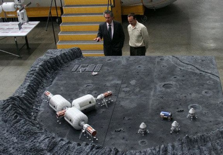 Space entrepreneur Robert Bigelow (left) discusses layout plans of the company's lunar base with Eric Haakonstad, one of Bigelow Aerospace's lead engineers.