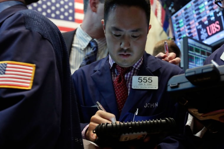 Trader John Song works on the floor of the New York Stock Exchange Thursday, May 23, 2013.