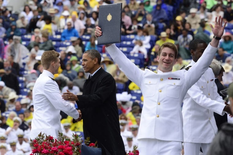 A Naval Academy graduate celebrates after receiving his diploma and commission as President Barack Obama congratulates graduates during the commencement ceremony for the United States Naval Academy, at the Navy-Marine Corps Memorial Stadium in Annapolis, Md., on Friday.