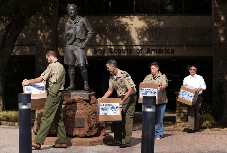 Activists, including Greg Bourke, second from left, and Jennifer Tyrrell, to his right, deliver boxes containing 1.4 million signatures urging the Boy Scouts of America to reverse the organization's ban on LGBT Scouts on February 4, 2013 in Irving, Texas.