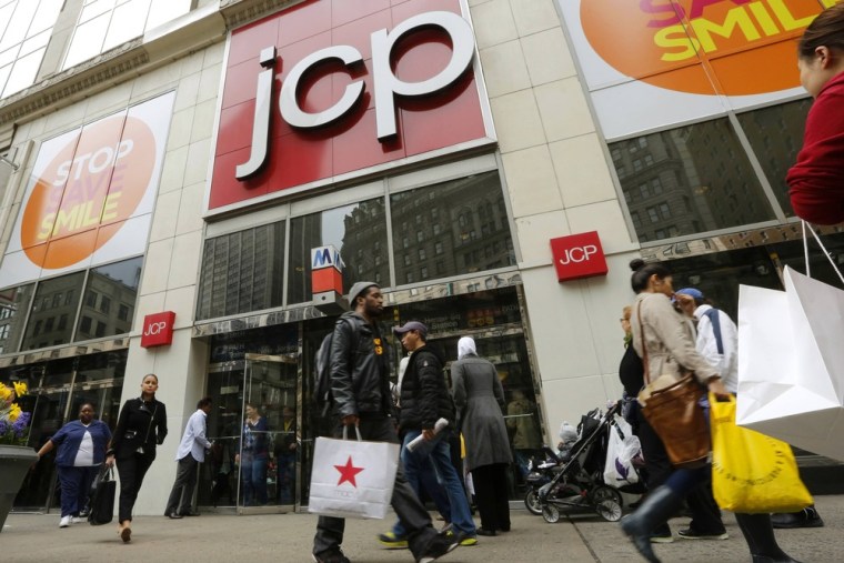 Shoppers walk past the J.C. Penney's store in New York in this file photo taken April 11, 2013.