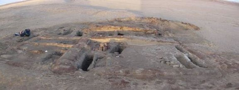 Archaeologists discovered the remains of a toddler in Romano-Christian-period cemetery in Dakhleh Oasis, Egypt, who showed evidence of child abuse. Here, mud bricks for two tomb structures in the cemetery. In the foreground are several excavated graves.