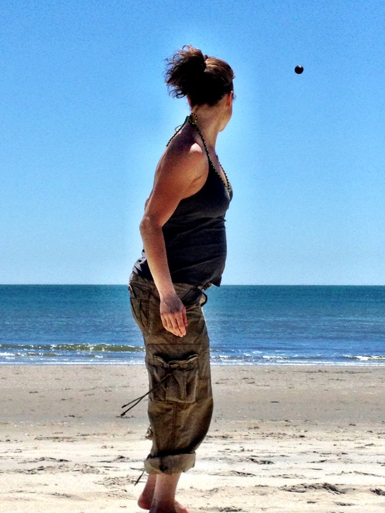 A very pregnant (27 weeks!) Jenna Wolfe plays football on Margate Beach in New Jersey.