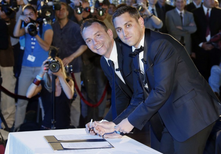 Vincent Autin (left), 40, and his partner Bruno Boileau, 30, were married by Montpellier's mayor on Wednesday, three days after a protest drew hundreds of thousands of opponents to Paris' streets.