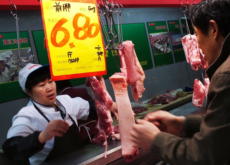 Image: Customer selects the pieces of pork