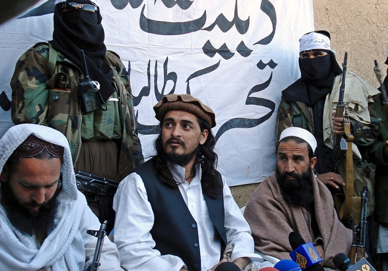 Hakimullah Mehsud, center, leader of Tehrik-i-Taliban Pakistan (Movement of Pakistani Taliban), talks with journalists in Pakistan's Orakzai tribal agency near the Afghanistan border on Nov. 26, 2008.