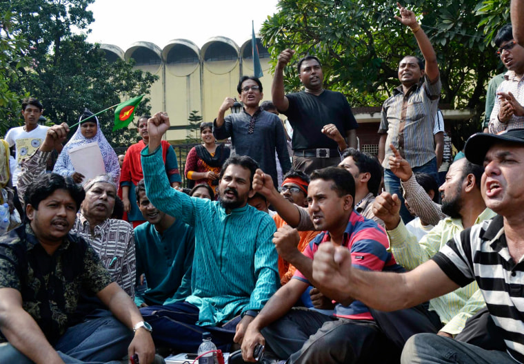 Bangladeshi cultural activists shout slogans to express their reaction after the verdict of a special tribunal sentenced two Bangladeshi nationals living abroad to death for crimes committed during the country's 1971 war against Pakistan
