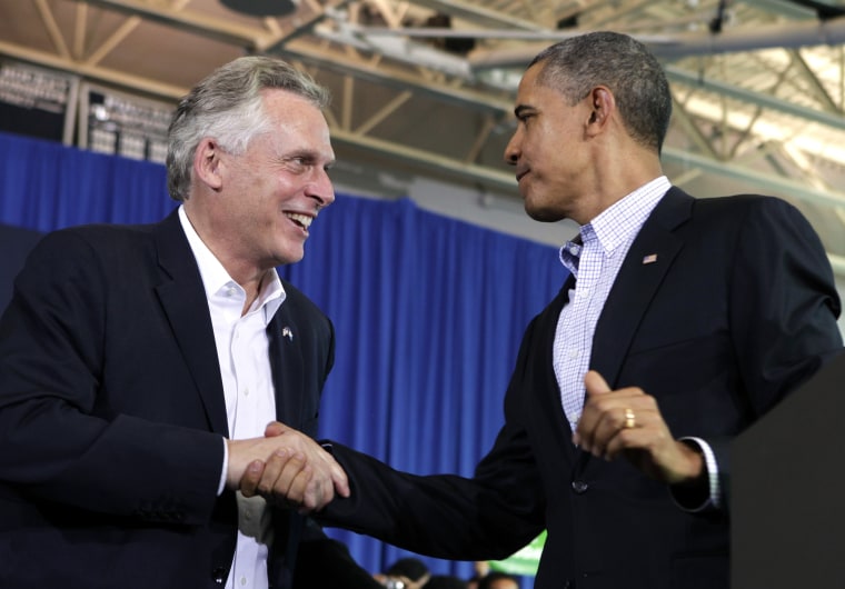 President Barack Obama (R) shakes hands with Terry McAuliffe at his campaign event for governor in Arlington, Virginia, November 3, 2013.