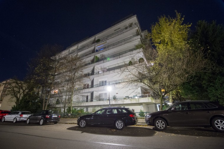 Cars are parked outside the apartment building where 1500 artworks were found in Munich, Germany, on Nov. 4.