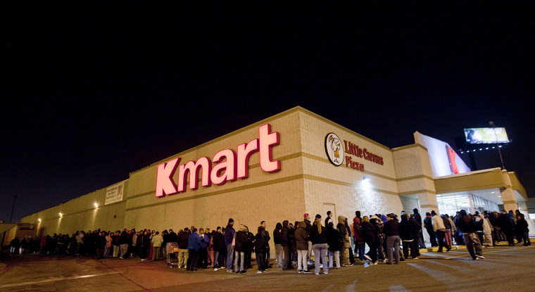 Customers wait in line for door buster deals at a Kmart in Chicago on Nov. 22, 2012. Kmart, which opened at 6 a.m. on Thanksgiving last year, is extending its pre-Black Friday shopping hours, starting at 6 a.m. on the holiday and staying open for 41 hours straight.