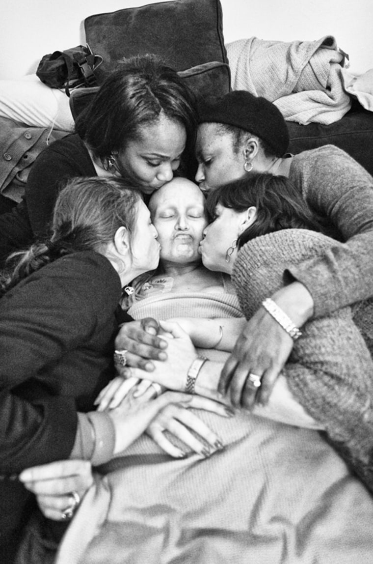 Women from Jennifer's breast cancer support group hold and kiss Jennifer. A few days earlier we were told that Jennifer's liver was failing and she on...