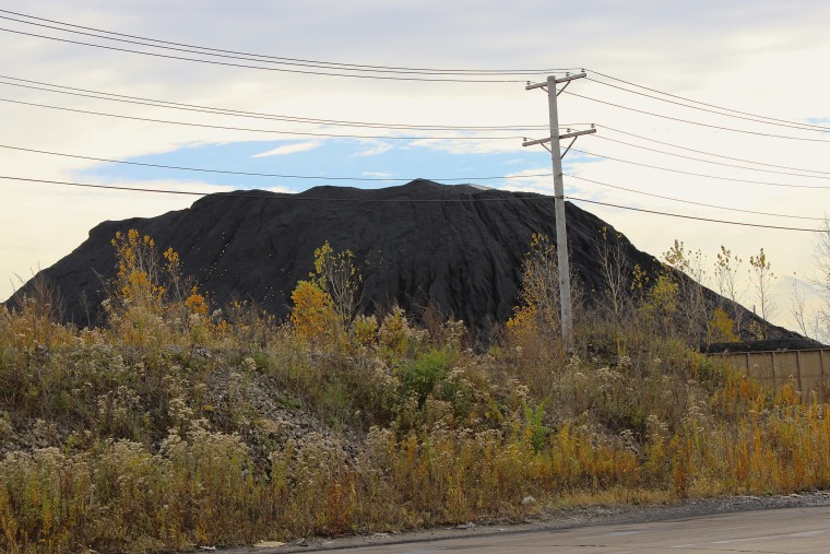 One of KCBX's petcoke piles looms over a telephone pole in southeast Chicago.