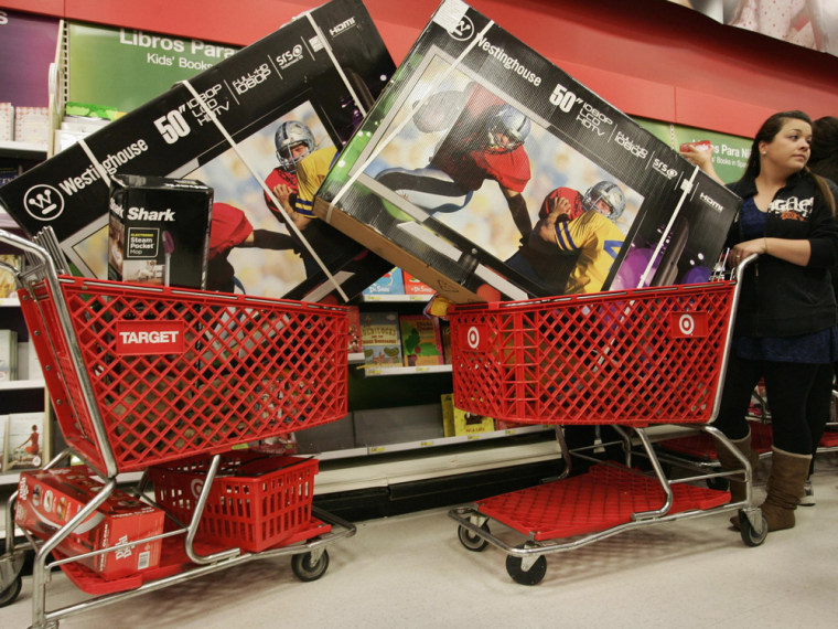 Victoria Wachowiak pushes a shopping cart with a 50-inch televison at Target