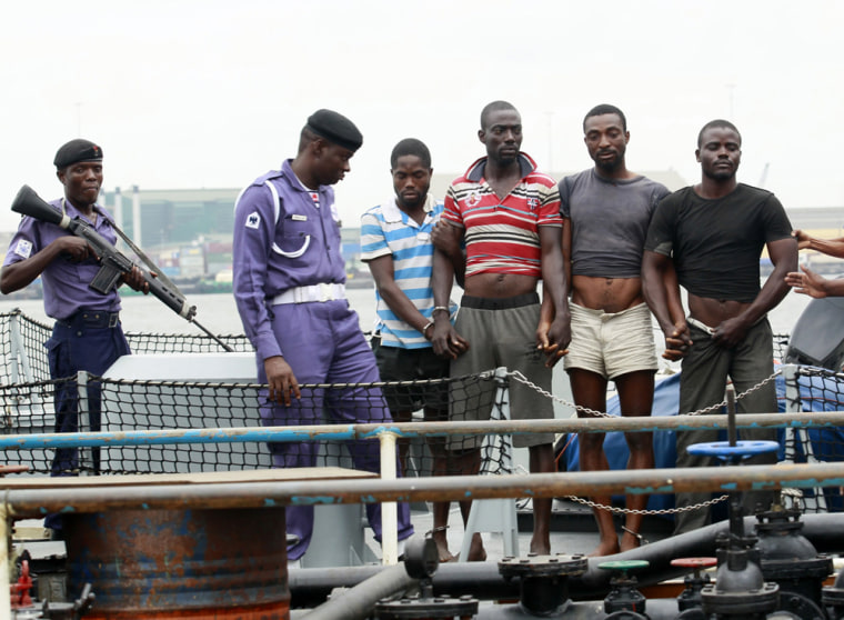 Suspected pirates are paraded aboard a Nigerian naval ship after their arrest in August.