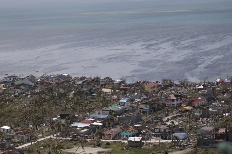 This aerial photo taken from a Philippine Air Force helicopter shows the devastation caused by Typhoon Haiyan in Guiuan, Eastern Samar province, centr...