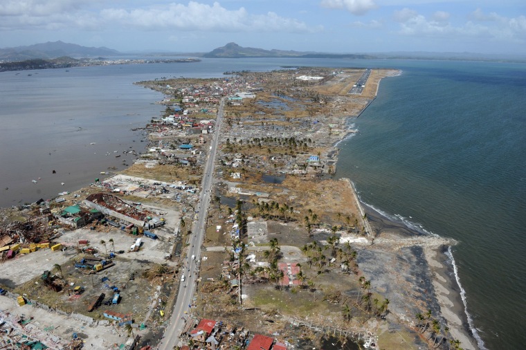 Destroyed houses and the airport terminal, upper right, in the city of Tacloban, Leyte province, in the central Philippines on Nov. 11, 2013.
