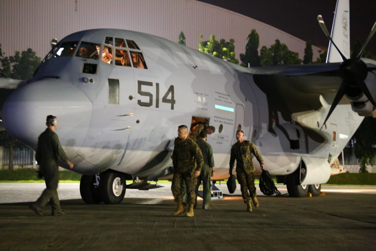 A handout picture made available by the U.S. Marine Corps on Nov. 11, 2013, shows U.S. Marines from the third Marine Expeditionary Brigade arriving in Manila, Philippines on Nov. 10.