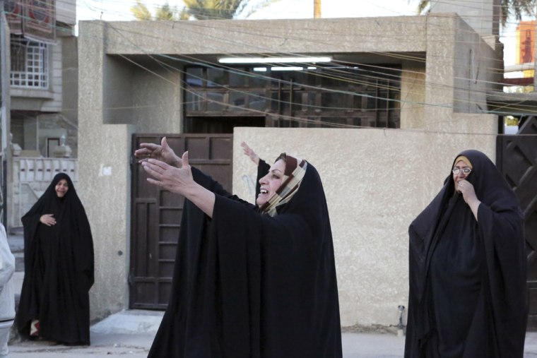 Women grieve after a deadly bomb attack during a funeral procession in Baghdad, Iraq, on Oct. 21.